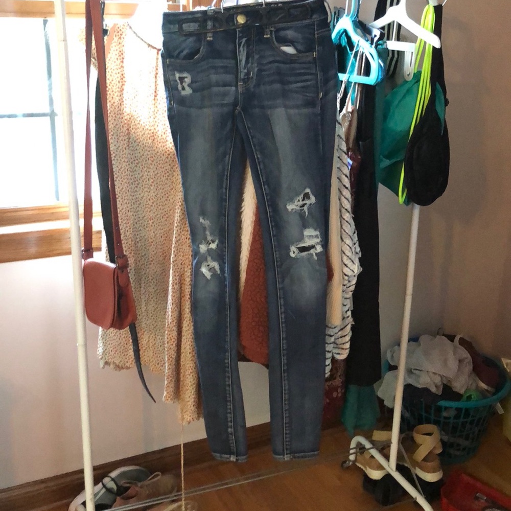 Distressed dark washed jeans